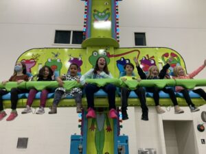 frog hopper with kids riding