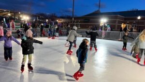 people skating on ice rink